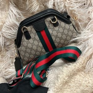 New Cossbody Leather bag with plastic protector over logo